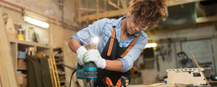 Afro american woman craftswoman working in her workshop