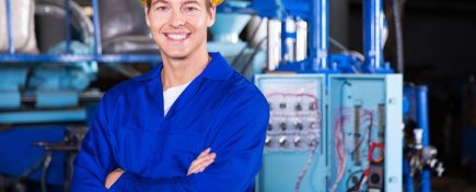 portrait of young technician with arms crossed