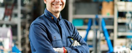 Portrait of a mechanic in his garage