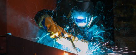 worker welding metal