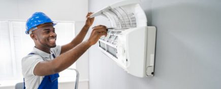 Technician Repairing Air Conditioner