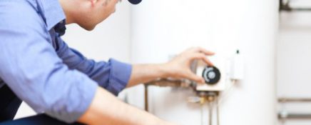 Technician repairing an hot-water heater