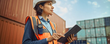 A woman who has completed logistics courses managing the supply chain outside
