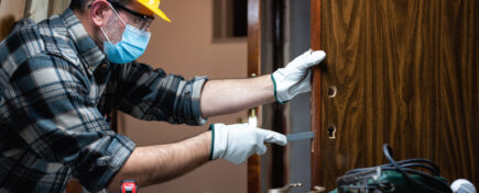 Renovation technician taking floor measurements after home renovation training