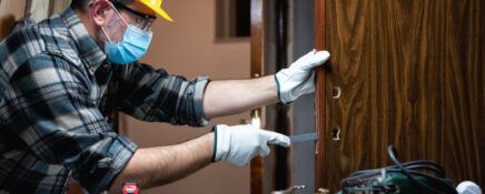 Renovation technician taking floor measurements after home renovation training