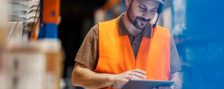 A logistics supervisor checking a shipment after their logistics training