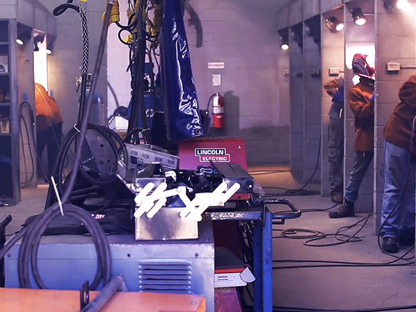 Welding students training in the Burlington campus lab