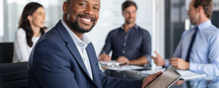 A Logistics manager in a meeting with stakeholders after logistics management training