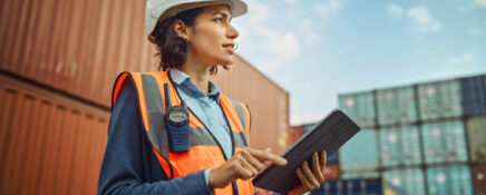 Female logistics manager outside a warehouse after logistics training