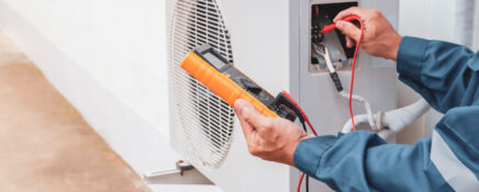 HVAC technician working on an air conditioning system