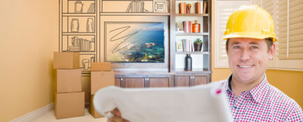 A home renovation technician assessing a renovation project after completing his home renovation training