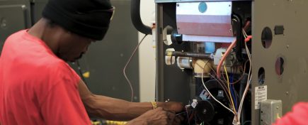 Image of an HVAC student working in the lab.