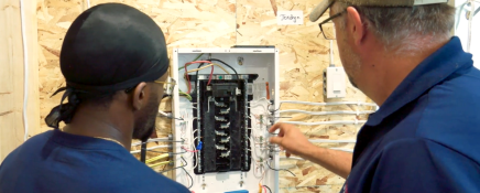 Image of CME Instructor and Student working in the lab